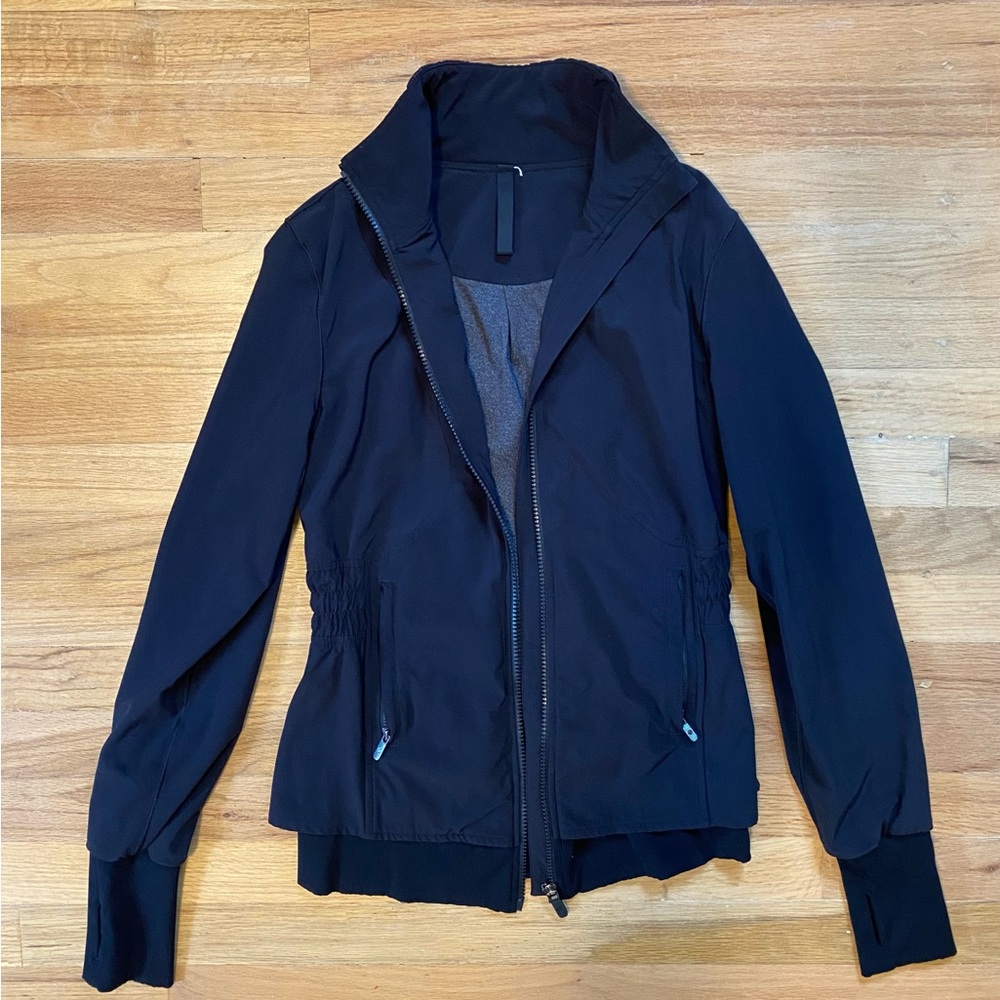 Lululemon Athletica women’s black track fitted zip-up jacket.